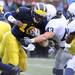 Michigan quarterback Denard Robinson is hit by Penn State University'sJosh Hull causing him to fumble during third quarter action of Saturday, October 24th's clash between the two teams at Michigan Stadium.
Lon Horwedel | AnnArbor.com